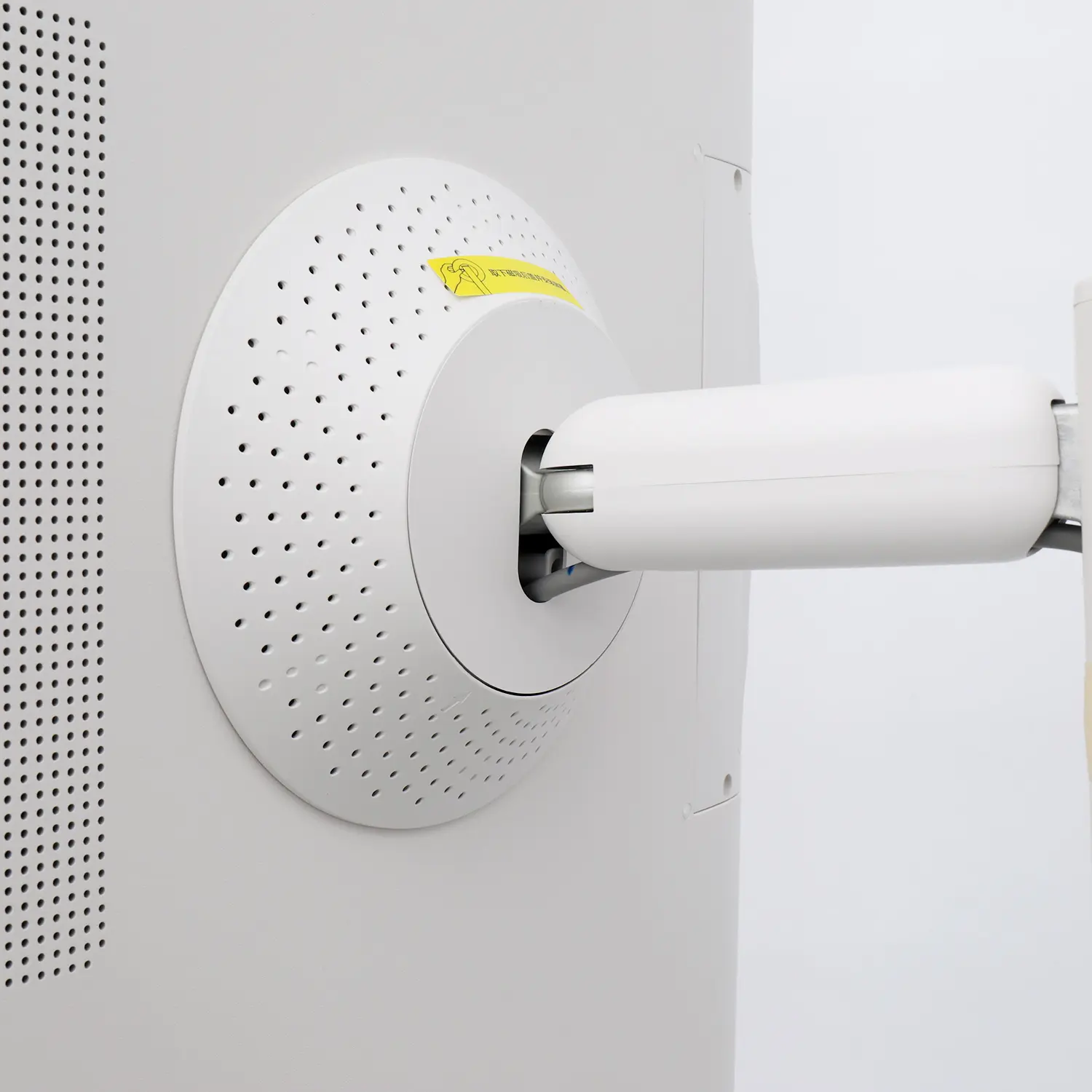 Close-up of the ventilated rear speaker chamber and steel hinge joint