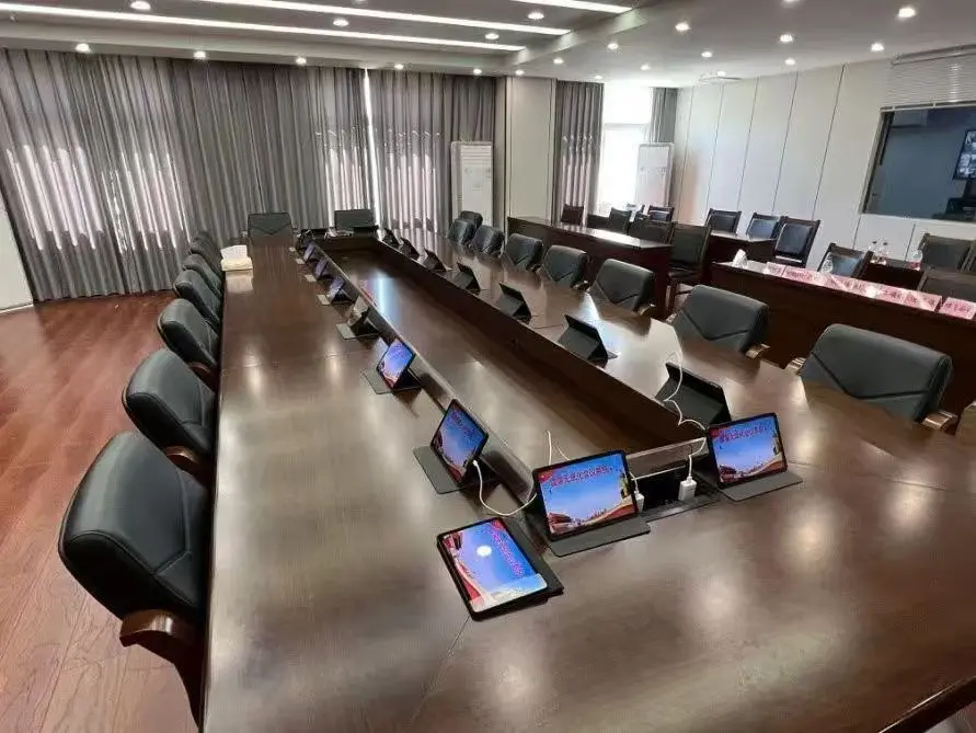 Boardroom conference table with touch panel per seat
