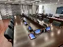 Boardroom conference table with touch panel per seat